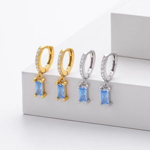 Close-up of S925 silver hoop earrings with rectangular blue zircon and micro-set crystals