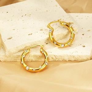 U-shaped gold plated stainless steel hoop earrings with sparkling cubic zirconia inlay