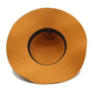 Detailed view of yellow wool felt fedora interior with adjustable strap and sweatband
