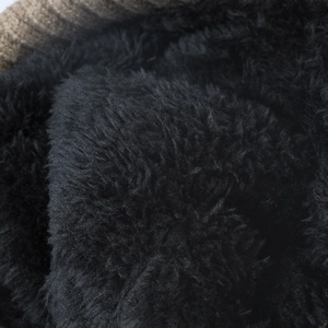 Warm winter beanie with thick black faux fur lining and brown knitted outer fabric