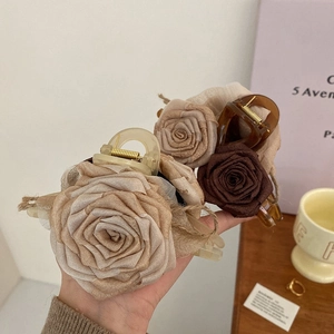 Large vintage rose hair claw clip in beige and brown silk fabric for women's hairstyles