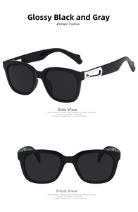 Detailed view of square sunglasses with silver hollow metal hinges and grey lenses