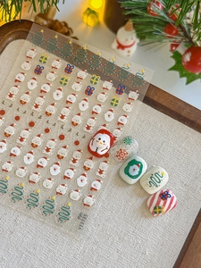 Détails d'autocollants 3D pour ongles avec Père Noël, bonshommes de neige et sapins festifs