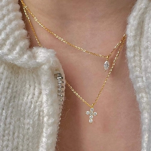 Detail of S925 silver double layer necklace featuring gold cross and marquise drop charms