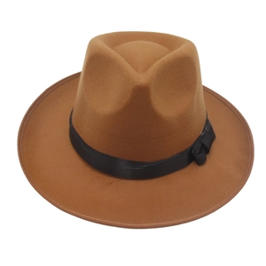 Detailed close-up of brown wool fedora with black satin ribbon and flat bow decoration