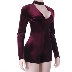 Detail of burgundy velvet bodysuit showing deep V-neckline and mock neck cutout design