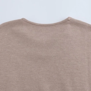 Detail of the crew neckline and fine knit texture on this warm brown midi skirt set top