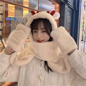 Close-up of fluffy cream 3-in-1 hat scarf gloves set with cute red reindeer antlers