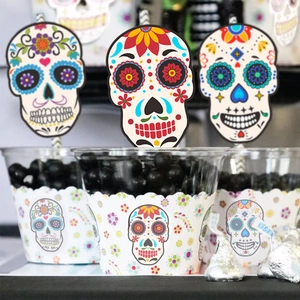 Close-up of Day of the Dead themed paper straws and wrappers with skull patterns