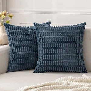 Detail of dark blue corduroy pillowcase showing soft ribbed texture and stitching