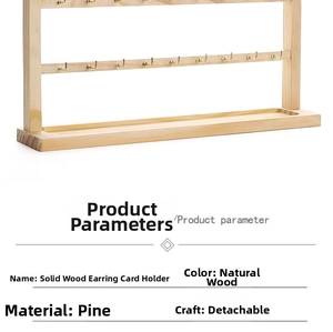 Detailed macro view of the natural pine wood texture and metal hooks on the earring display