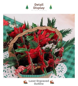 Macro shot of 3D Christmas pop-up card featuring laser-cut poinsettia floral basket