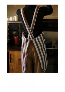 Cross-back X-shape straps on blue striped apron ensuring easy wear and anti-slip fit