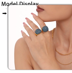 Close-up of gold plated stainless steel rings featuring micro-set blue zircon stones