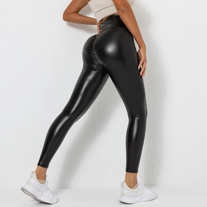 Detail view of black high waist faux leather leggings with scrunch butt lifting effect