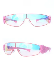 Detail of pink Y2K sunglasses with gradient lenses and 3D heart-shaped temple design