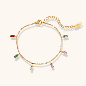 Detail of 18K gold bracelet featuring six vibrant baguette-cut multi-color gemstones