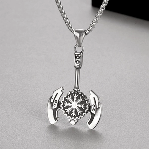 Macro shot of silver stainless steel Viking double-headed axe pendant with Vegvisir runes
