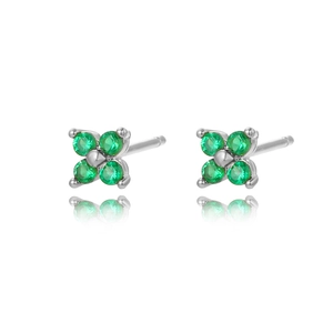 Macro detail of silver four-leaf clover stud earrings with sparkling green gemstones