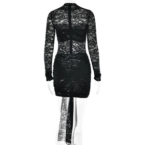 Detail of lace dress back featuring hidden zipper closure and ruffled hip design