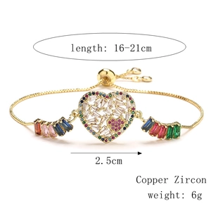 Macro detail of adjustable heart bracelet with multi-color zircon and copper gold plating