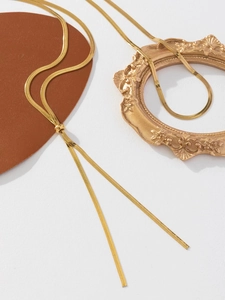 Detailed view of golden snake chain necklace with spherical sliding adjustable clasp