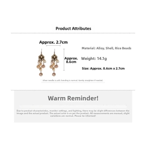 Detail view showing shell tassel earrings with dimensions 8.6cm and floral metal alloy studs