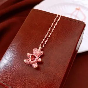 Elegant rose gold teddy bear necklace with pink zircons and red heart stone pendant