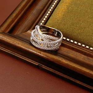 Macro shot of silver multi-layer crisscross ring with pavé-set cubic zirconia stones