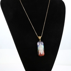 Rainbow crystal gemstone necklace with sacred geometry engraving on a gold chain