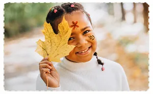 Detail of waterproof autumn pumpkin and maple leaf temporary face tattoos for festivals