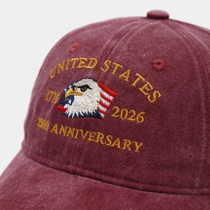 Detailed close-up of high-density embroidery on vintage washed burgundy baseball cap