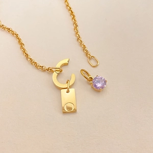 Elegant gold titanium steel necklace with initial O tag and faceted purple stone pendant