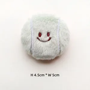 Plush tennis racket charm with cute smiling face embroidery, H: 4.5cm by W: 5cm