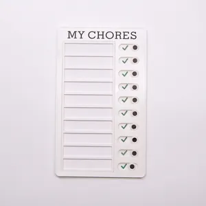 Detail of white My Chores checklist board with sliding toggle buttons for daily tasks