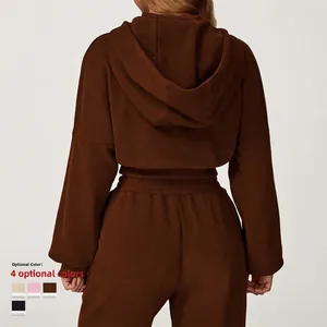 Women's brown oversized hooded tracksuit set featuring relaxed knit sweatshirt and joggers