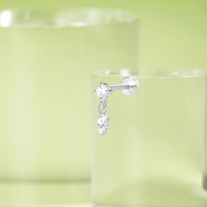 Macro detail of S925 silver stud earring with cubic zirconia stones and 925 hallmark