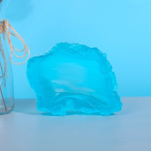 Deep ocean blue translucent resin mold piece with natural irregular ice texture