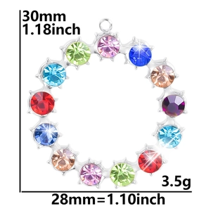 Macro view of 28x30mm 18k gold plated ring pendant with multicolored faceted gemstones