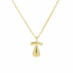Macro view of polished 18k gold plated mushroom pendant and delicate O-chain necklace