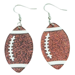 Brown glittery acrylic rugby football earrings with white stitching on plain white background
