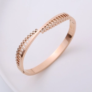 Polished rose gold hollow triangle bangle with rhinestone crystals in geometric style