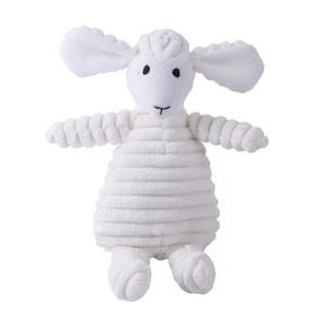 Close-up of white lamb plush dog toy showing detailed corduroy texture and black embroidery