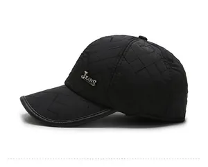 Close-up of quilted baseball cap with JEANS metal logo and premium leather brim edge