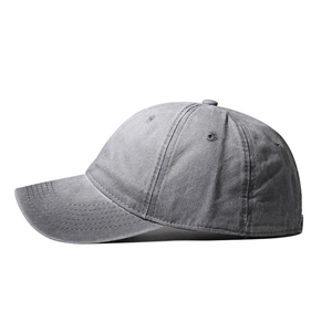 Detail of gray washed cotton baseball cap showing stitching on curved brim and eyelets