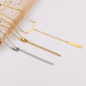 Detail of minimalist stainless steel geometric pendant necklaces with secure lobster clasps