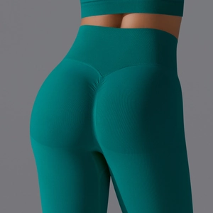 Close-up of seamless scrunch butt yoga pants with high waist design in teal green