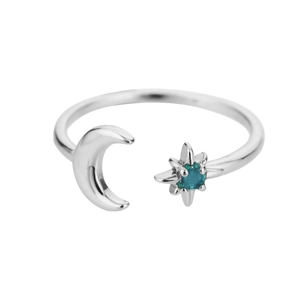 Detailed view of silver crescent moon and blue gemstone star open ring design