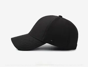 Detailed side view of black cotton baseball cap showing fine metallic square logo