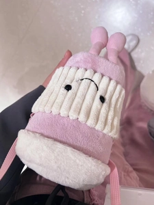 Detailed plush pink and white cartoon water bottle carrier with cute smiling embroidery